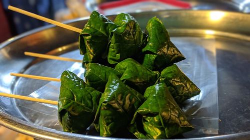 Close-up of green leaves on table