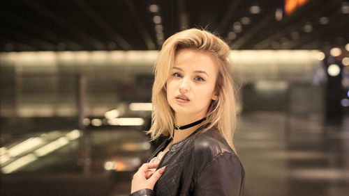 Portrait of young woman at railroad station