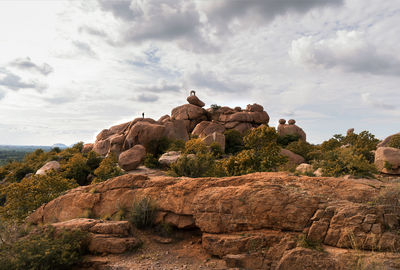 Rock formations on landscape against sky