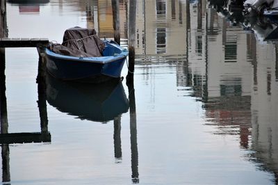 Boats moored in lake