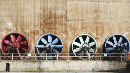 Factory seen through metal gate against wall