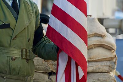 Close-up of flags against built structure