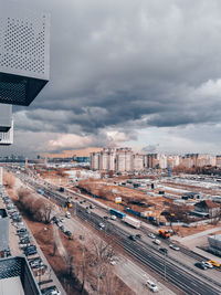 High angle view of city street and buildings against sky