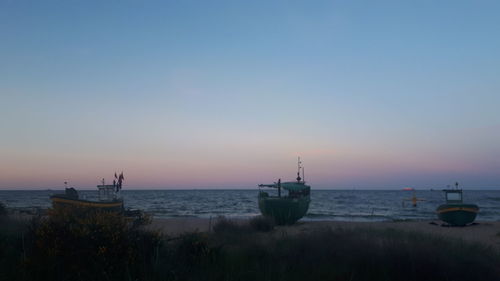 Scenic view of sea against clear sky during sunset