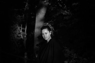 Portrait of beautiful young woman looking away