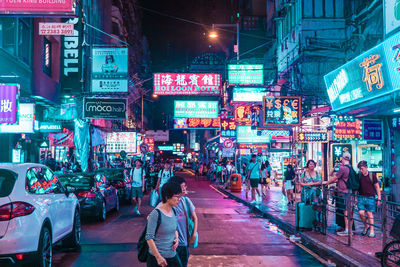 People on city street at night