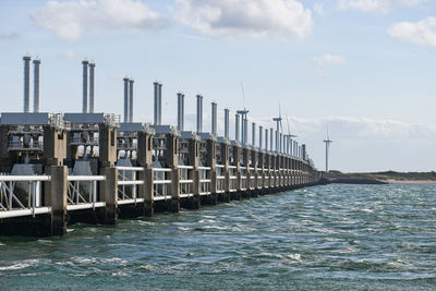 Pier over sea against sky