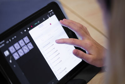 Hand using digital tablet