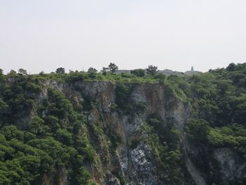 Scenic view of waterfall against clear sky