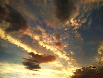 Low angle view of dramatic sky during sunset