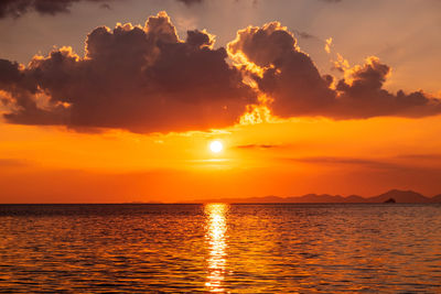 Scenic view of sea against romantic sky at sunset