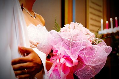 Close-up of woman holding flower bouquet