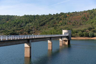 Bridge over river against sky