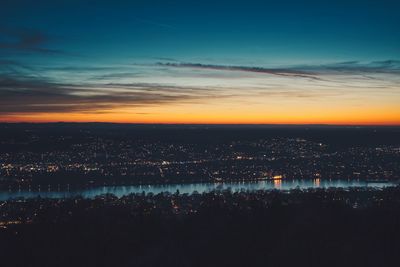 Aerial view of city against sky at sunset