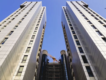 Low angle view of modern buildings against clear sky