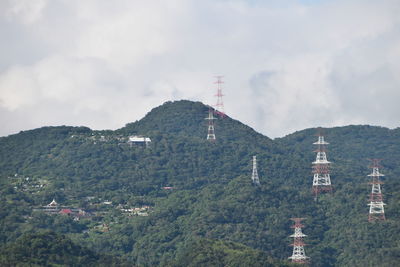 Panoramic view of buildings and mountains against sky