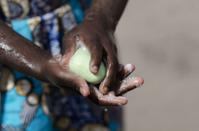 Close-up of hand holding ice cream