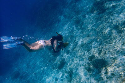 High angle view of man swimming in sea