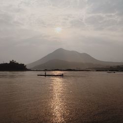 Scenic view of lake against sky during sunset