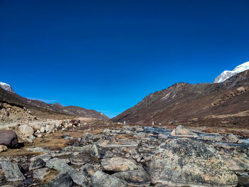 Scenic view of rocky mountains against clear blue sky