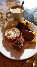 High angle view of cake and coffee on table