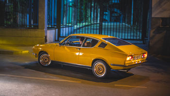 YELLOW CAR ON ROAD