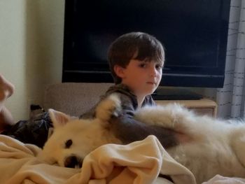Boy with dog at home