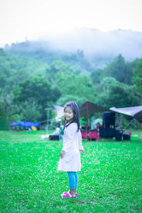 Full length of woman standing on field