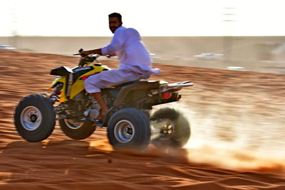 Man riding motorcycle on road