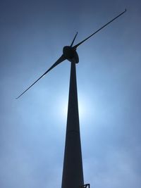 Low angle view of windmill against sky