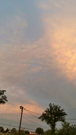 Low angle view of power lines against sky