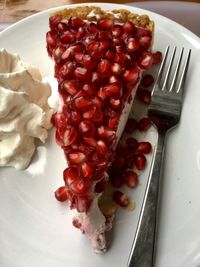 High angle view of strawberries in plate on table