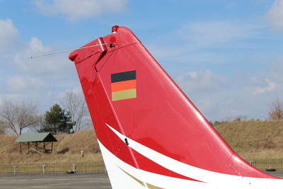 Close-up of red flag against building