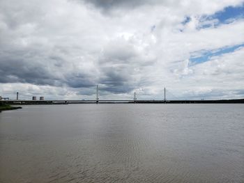 Bridge over sea against sky