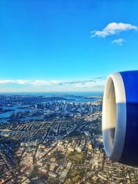 Aerial view of cityscape against sea