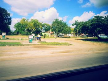 View of road against cloudy sky