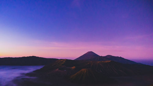 Scenic view of mountains against sky during sunset