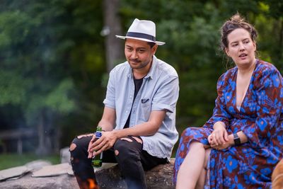 Young couple sitting outdoors