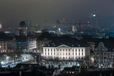 High angle view of buildings at night