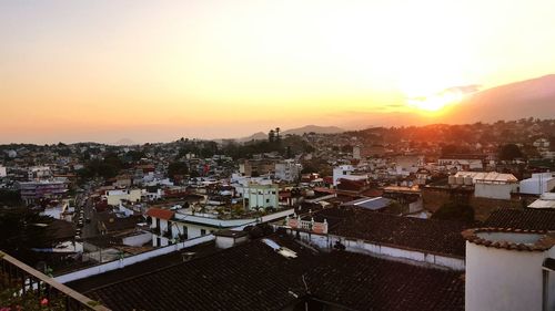 High angle view of city at sunset