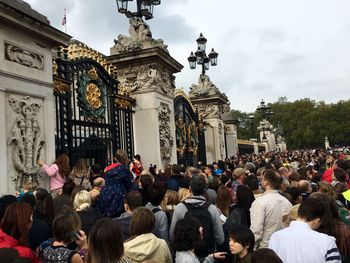 Crowd gathered outside historic building