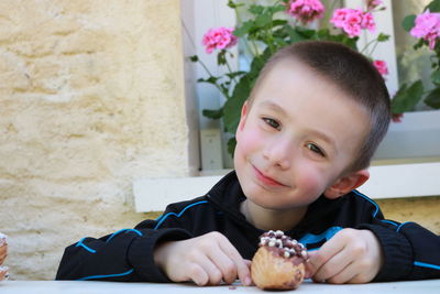 Portrait of boy holding food