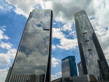 Low angle view of modern buildings against sky