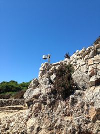 Rock against clear blue sky