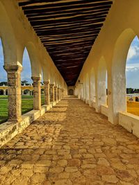 Empty corridor along buildings