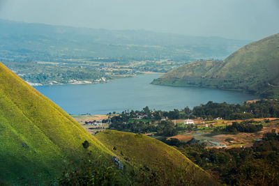 Scenic view of landscape and mountains against sky