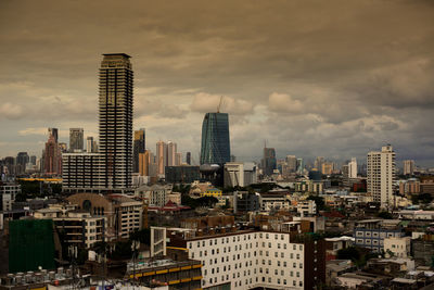 Modern buildings in city against sky