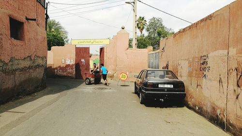 People working on street against sky