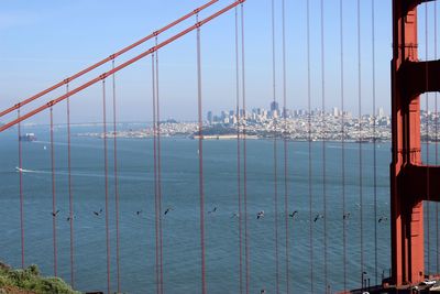 View of suspension bridge in sea