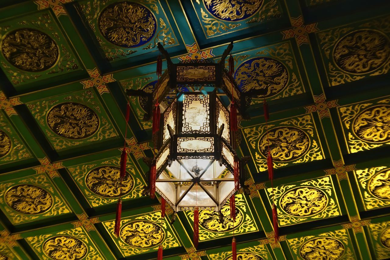 DIRECTLY BELOW SHOT OF ORNATE CEILING IN TEMPLE